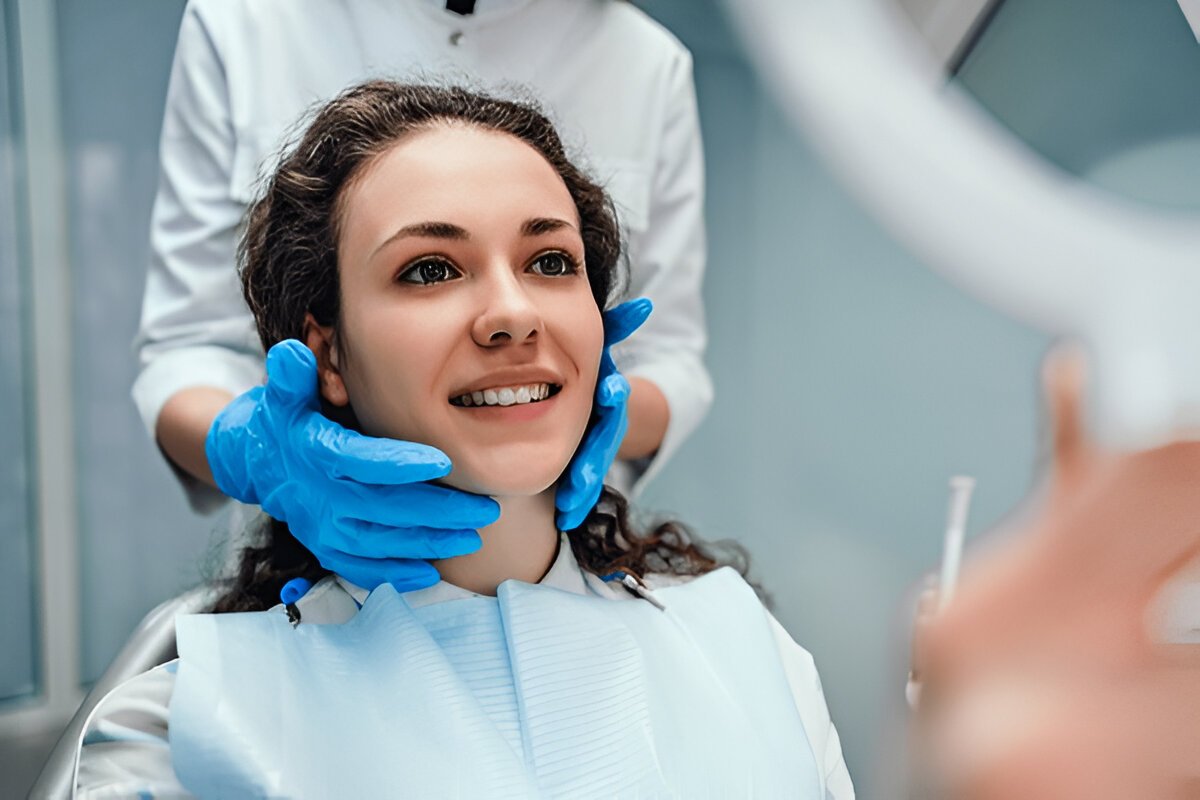 Smiling woman at Granada Dental receiving gentle dental care in Sherwood Park